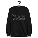 Image of the back of a black sweatshirt , pictures of three cute dogs, says "Run all the miles, pet all the dogs"